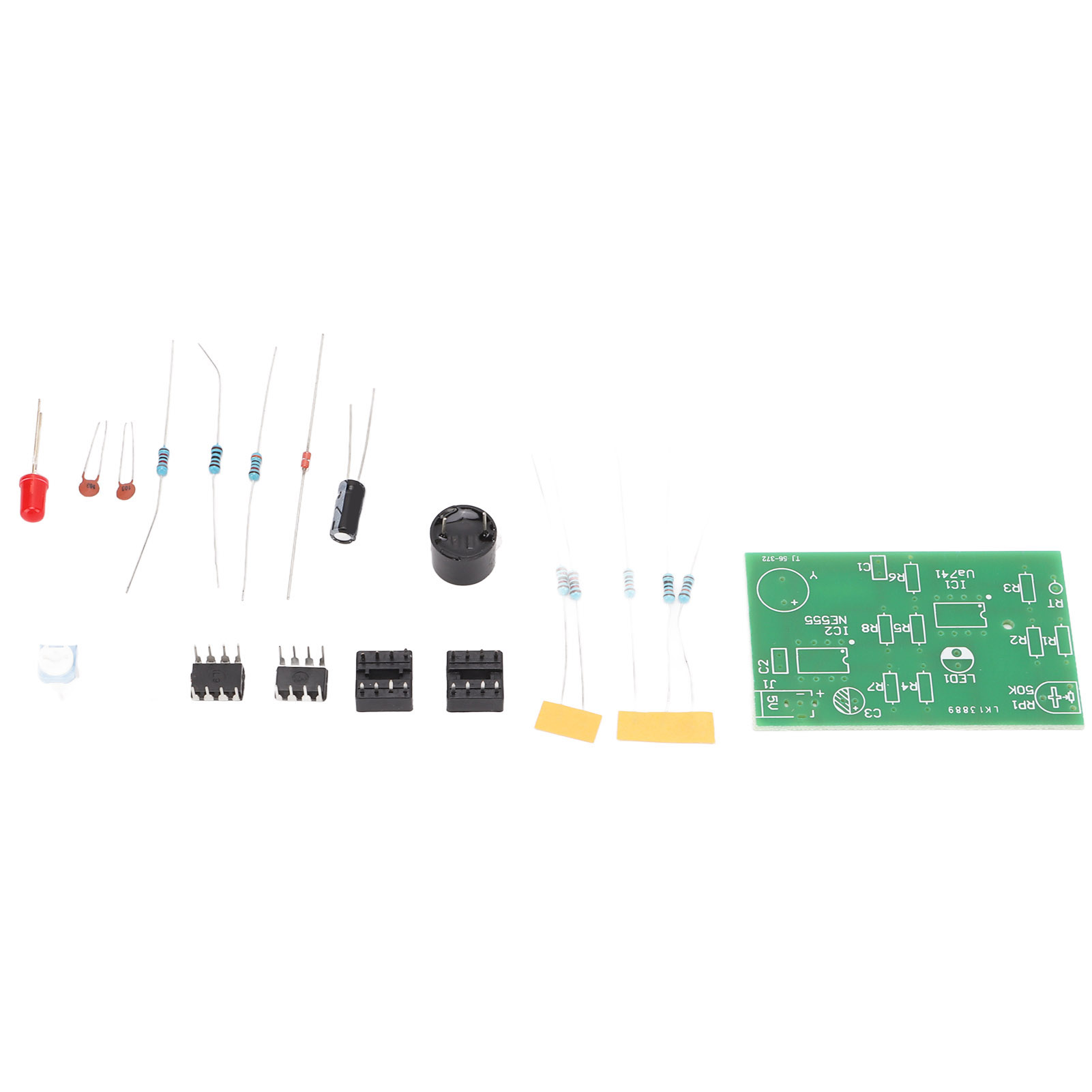Elektronische Bauteile, darunter Widerstände, Kondensatoren und eine Leiterplatte mit beschrifteten Abschnitten.