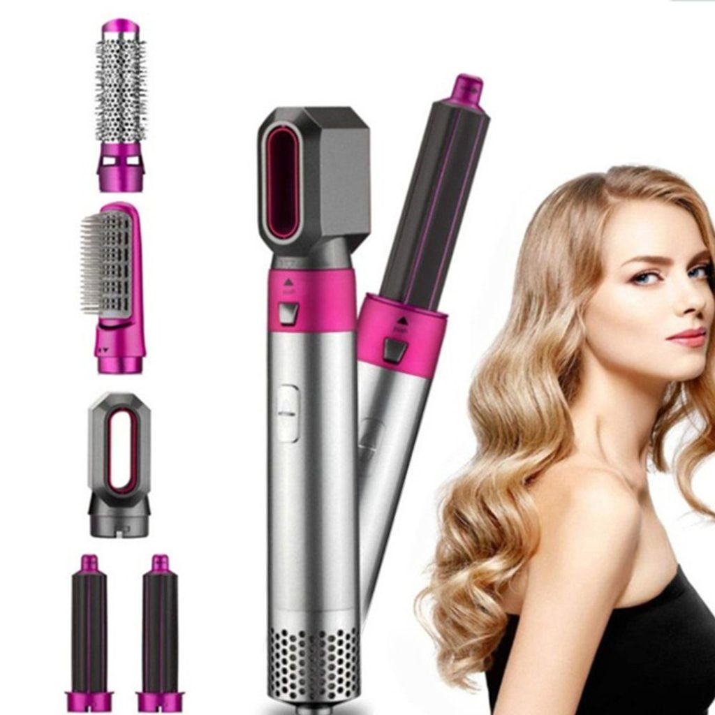 Frau und Haarstyling-Werkzeugset mit mehreren Aufsätzen. Pinke und silberne Farben.