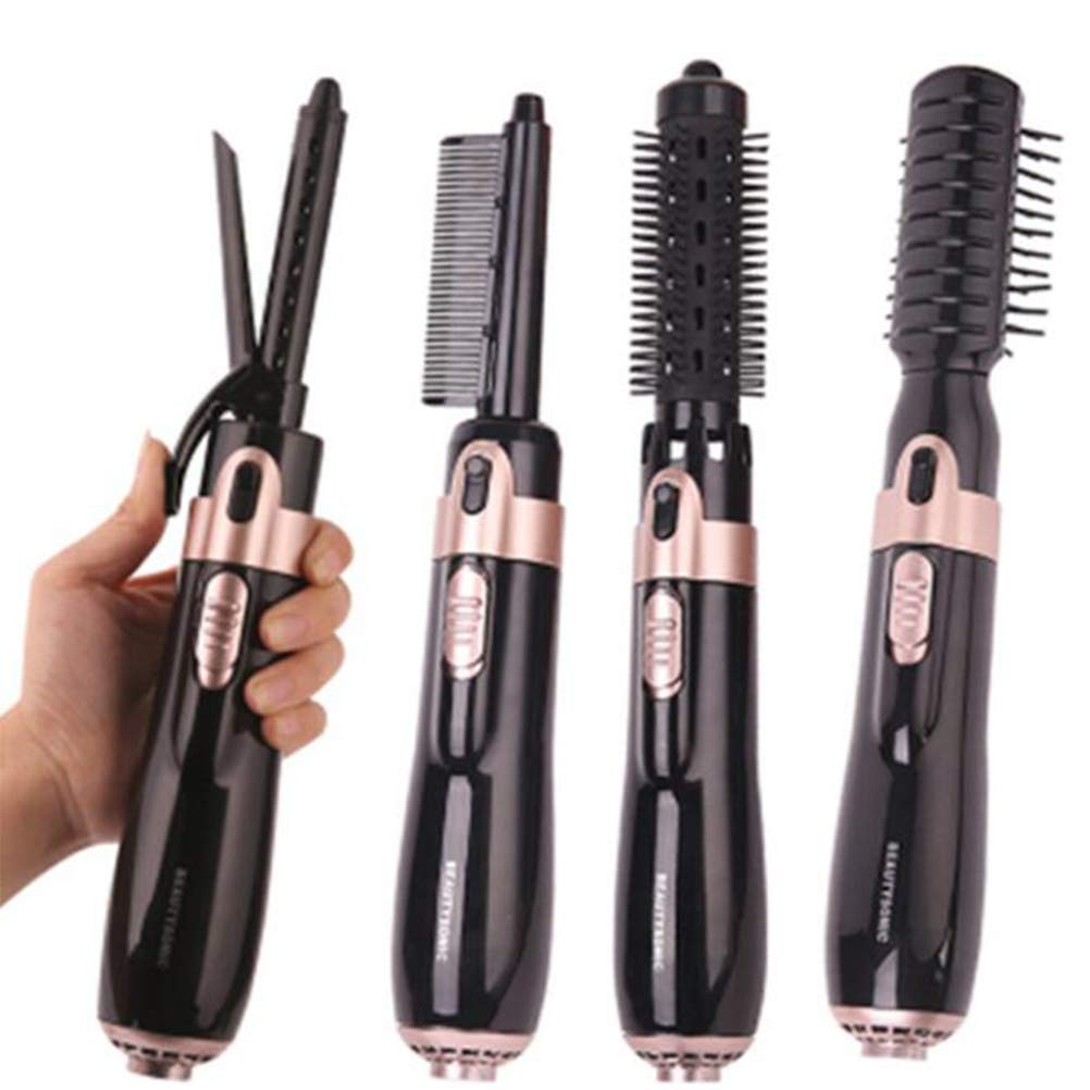 Vier schwarze Haarstyling-Tools mit roségoldenen Akzenten, gehalten von einer Hand.