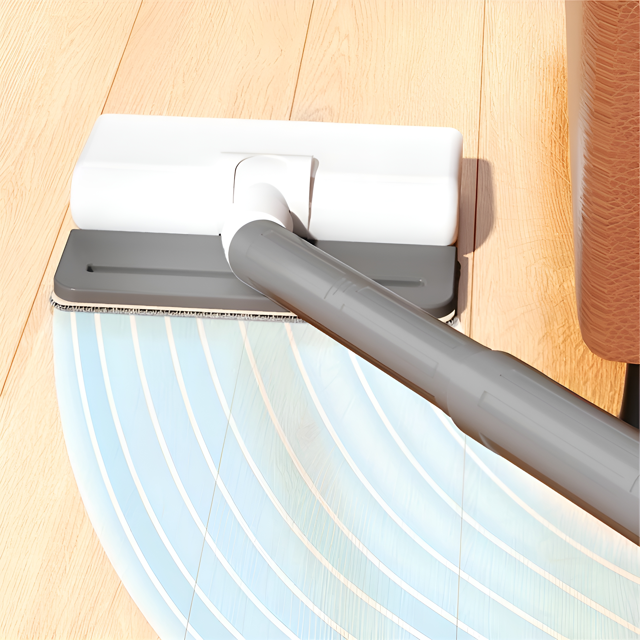 Mop auf einem Holzboden. Der Mopp ist weiß und grau und reinigt in einem Bogenmuster.