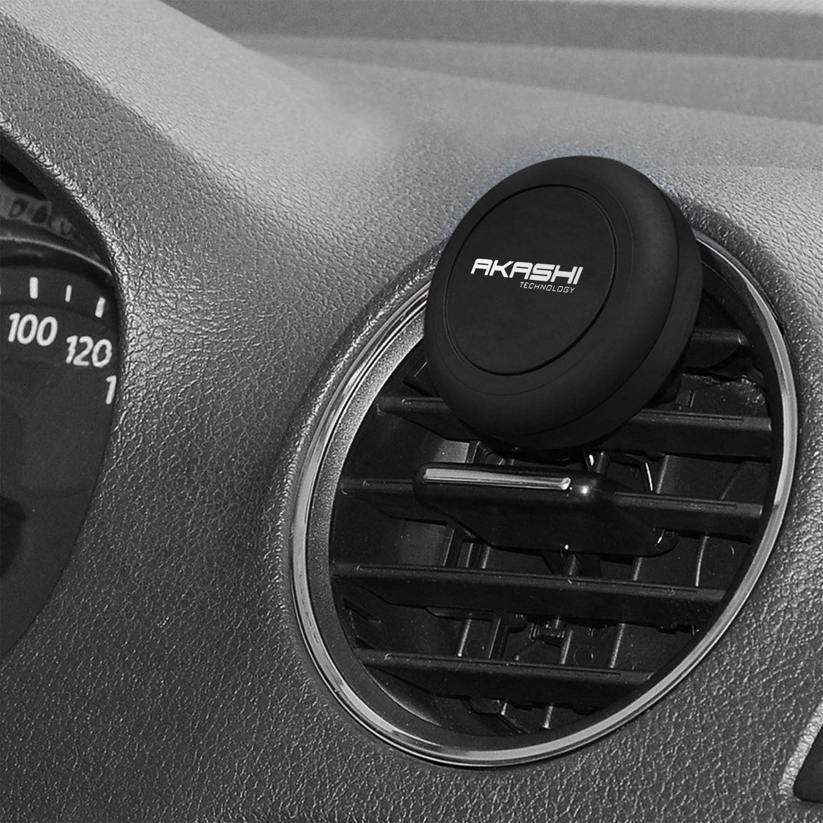 Un supporto magnetico nero per telefono da auto attaccato a una presa d'aria, con il marchio 'AKASHI'.