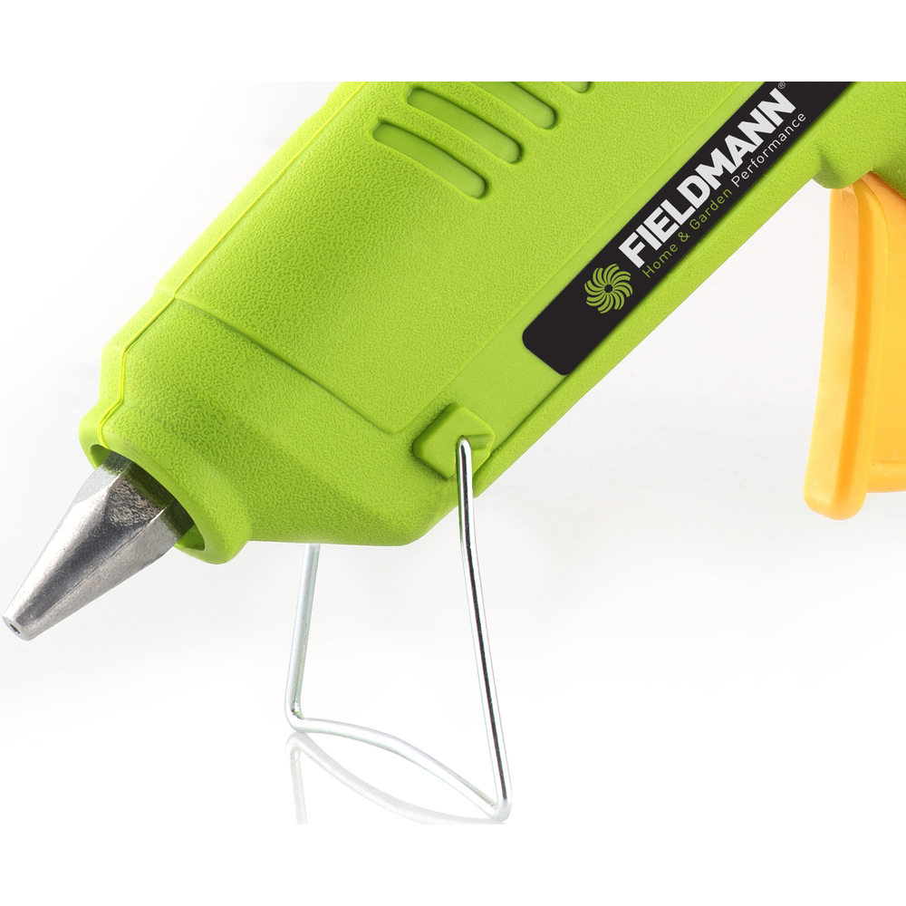 Pistola per colla verde e gialla, con supporto in metallo e ugello.