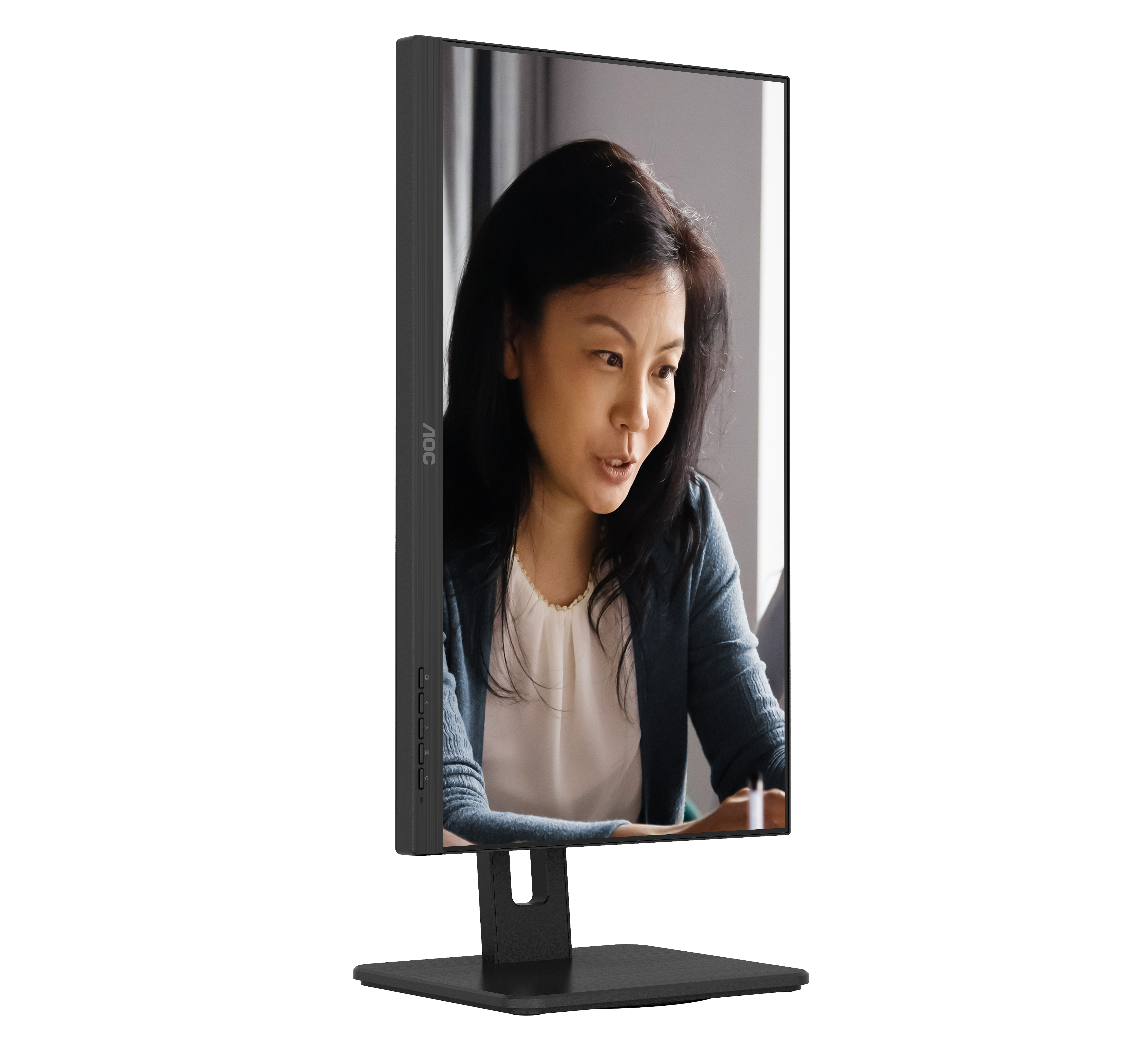 A black AOC monitor displaying a woman on screen, with a black stand.