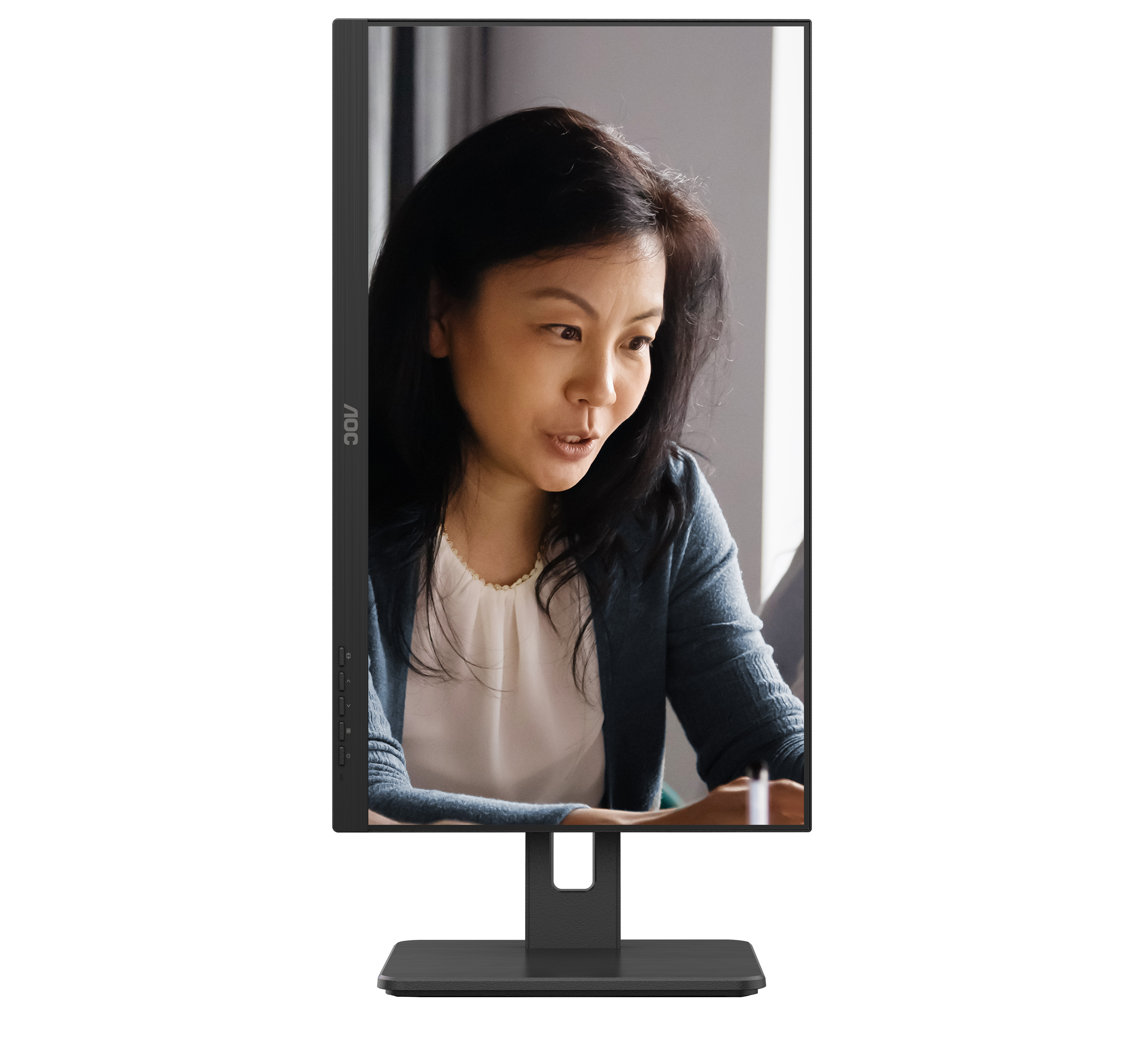 A computer monitor displaying a woman in a light blue jacket talking. The monitor is black.