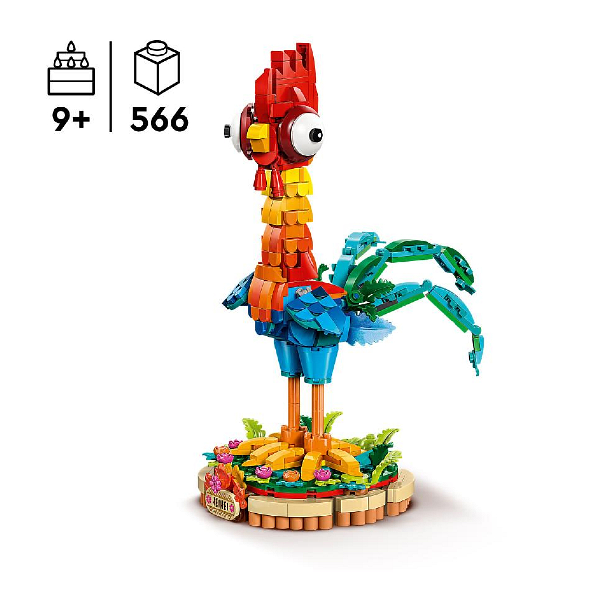 Kırmızı, sarı, mavi ve yeşil renklerde bir Lego horoz modeli, beyaz bir arka plan üzerinde.