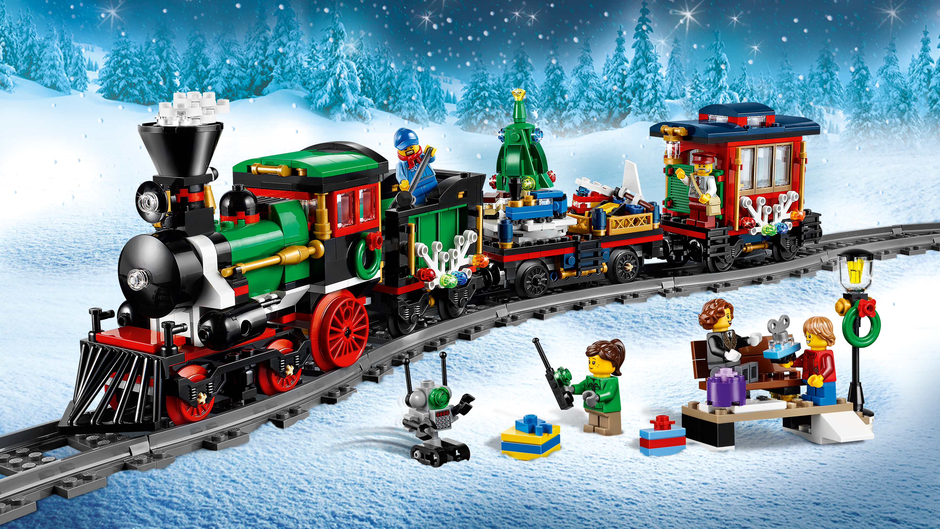 A Lego Christmas train set with figures, snow, and a snowy background.