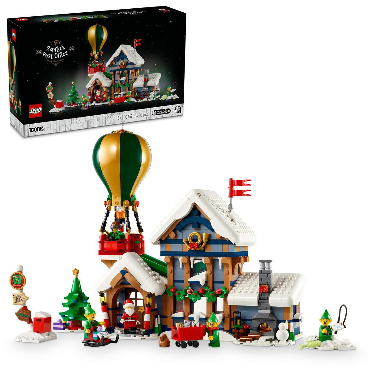 Una scatola di set LEGO e un edificio LEGO a tema natalizio con mongolfiera e l'ufficio postale di Babbo Natale.