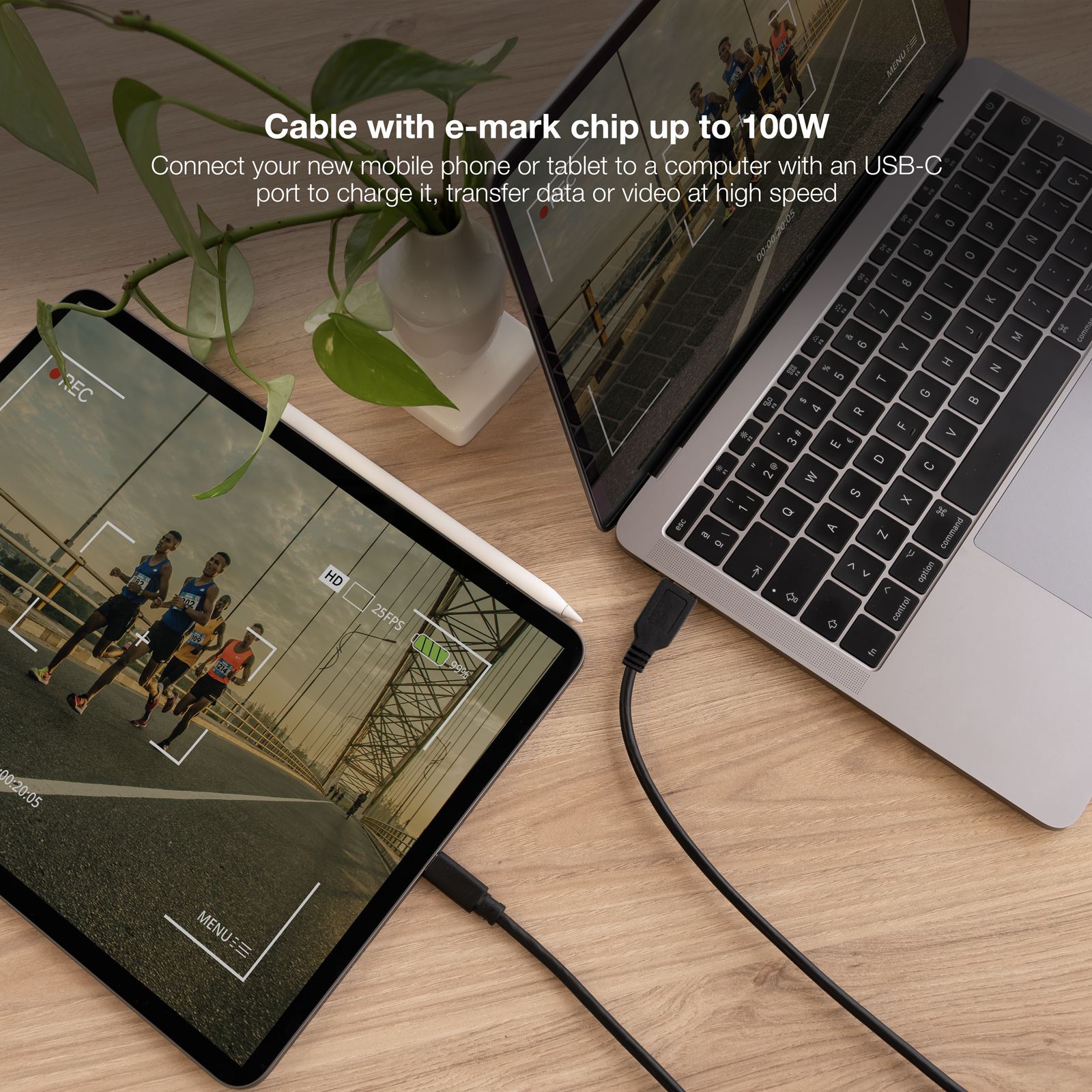 Tablet charging with USB-C cable. Running people on screen. Text: Cable with e-mark chip up to 100W.
