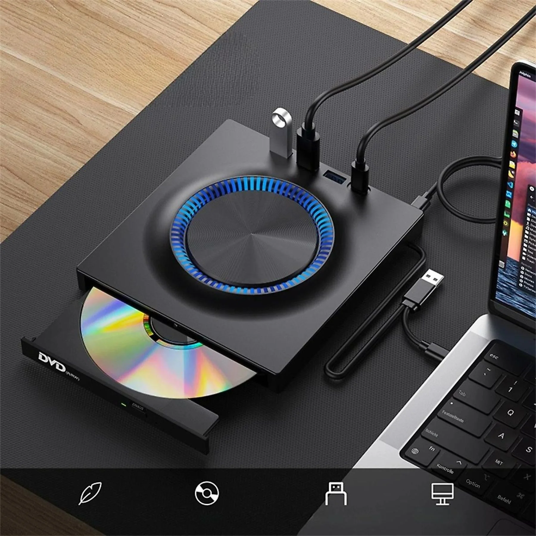 Schwarzes DVD-Laufwerk mit eingelegter Disc, verbunden mit einem Laptop und USB-Geräten auf schwarzem Untergrund.