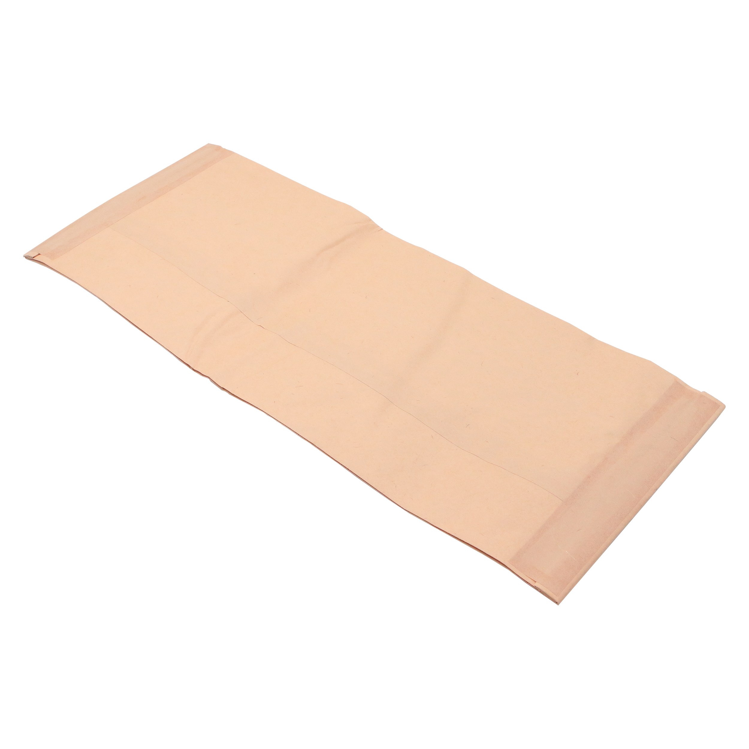 Eine beige, rechteckige medizinische Spange liegt diagonal auf einer weißen Oberfläche.