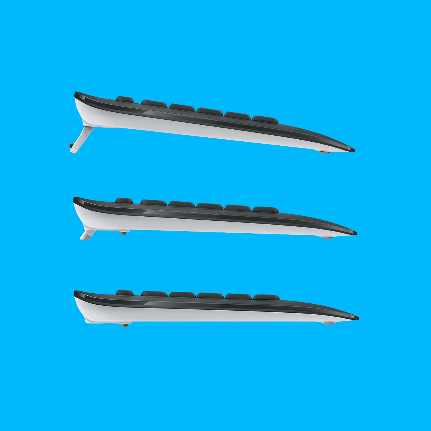 Trzy klawiatury, widok z boku, na niebieskim tle. Klawisze są czarno-białe.