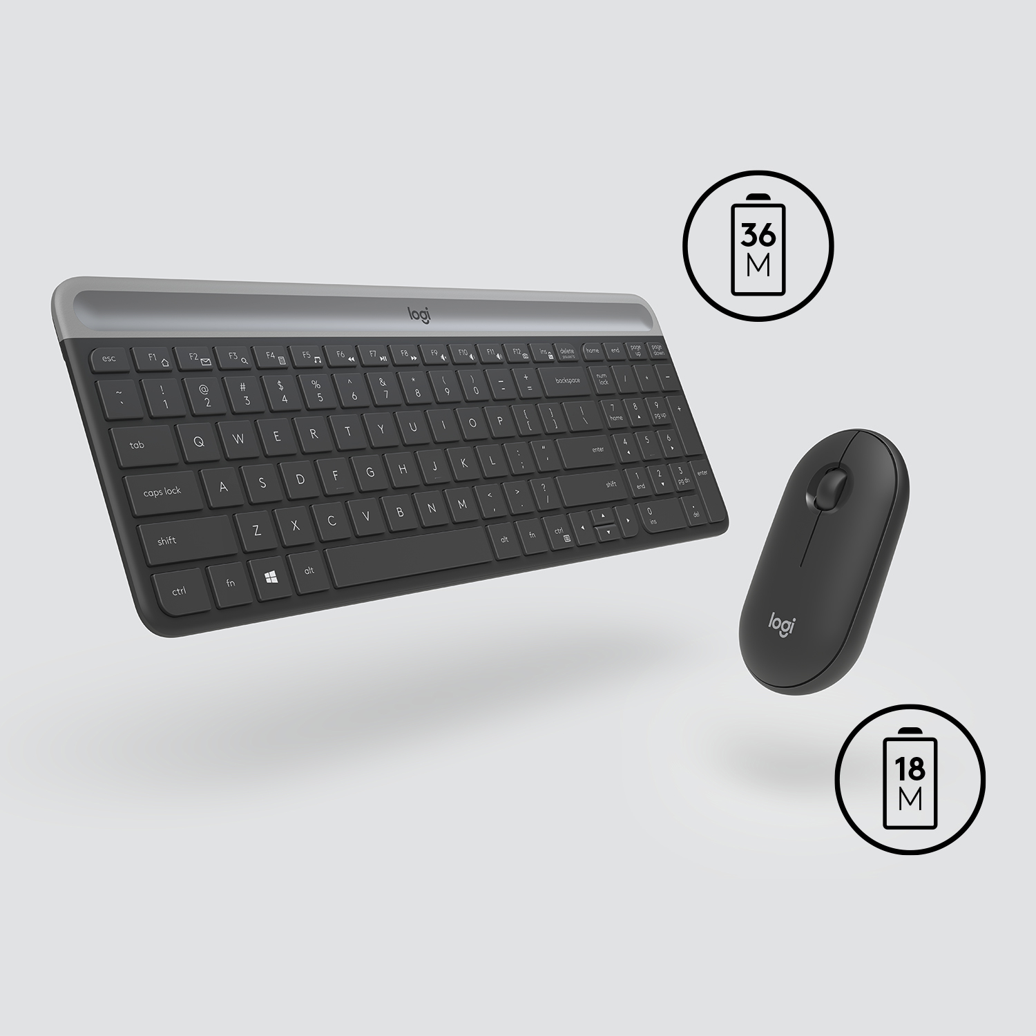 Combo de teclado y ratón negro. Teclado plateado. Indicadores de batería.