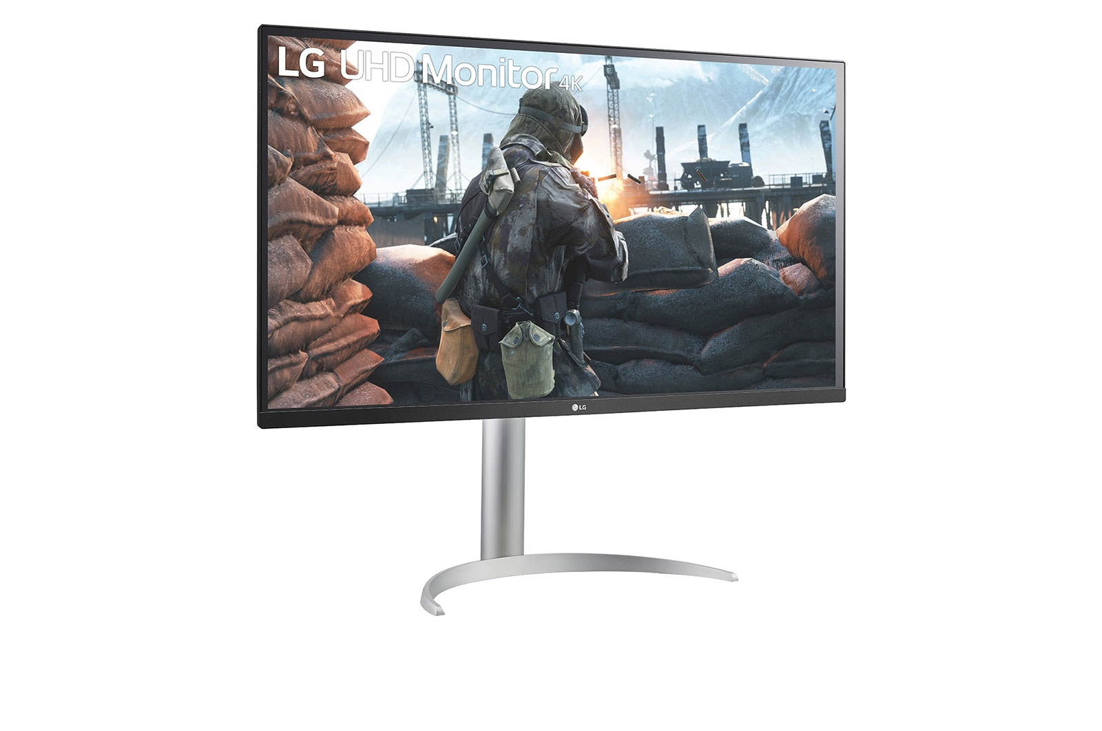 A monitor displays a war scene with soldiers in a trench, in front of white background.