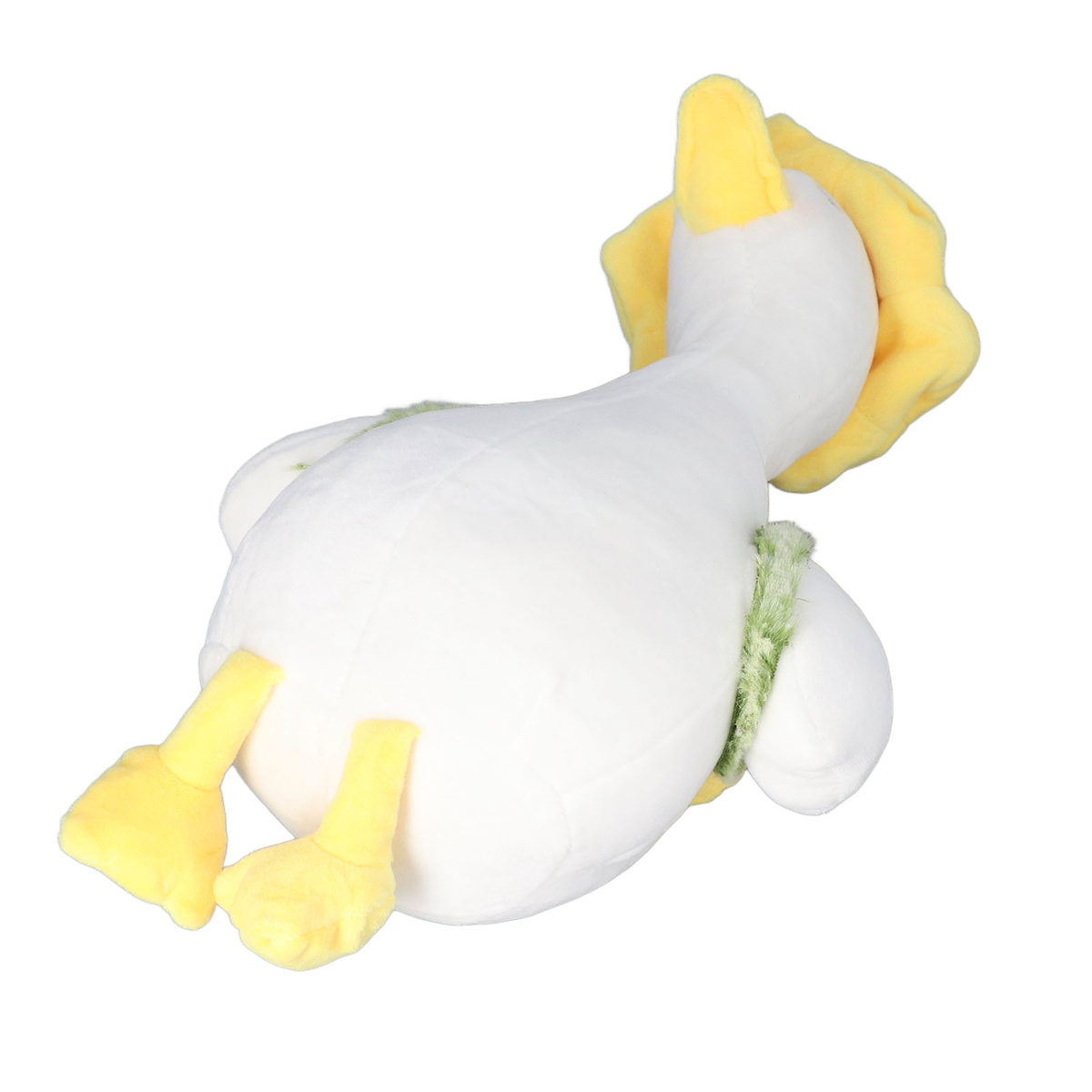 Weißes Stofftier-Ente liegt. Gelbe Füße, Schnabel und Kopf. Grüner Schal um den Hals.