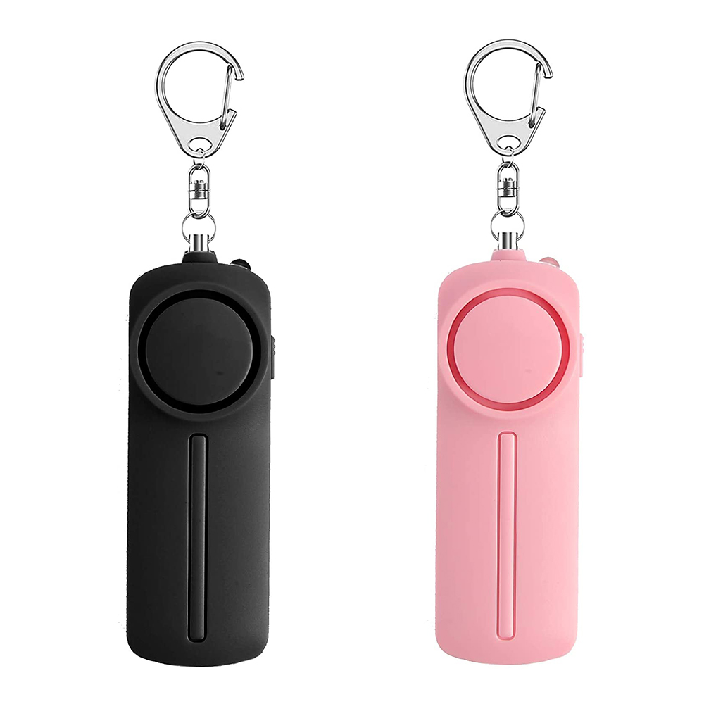 Zwei Personenalarme. Einer schwarz, einer rosa. Beide haben eine Schlaufe und einen Knopf.