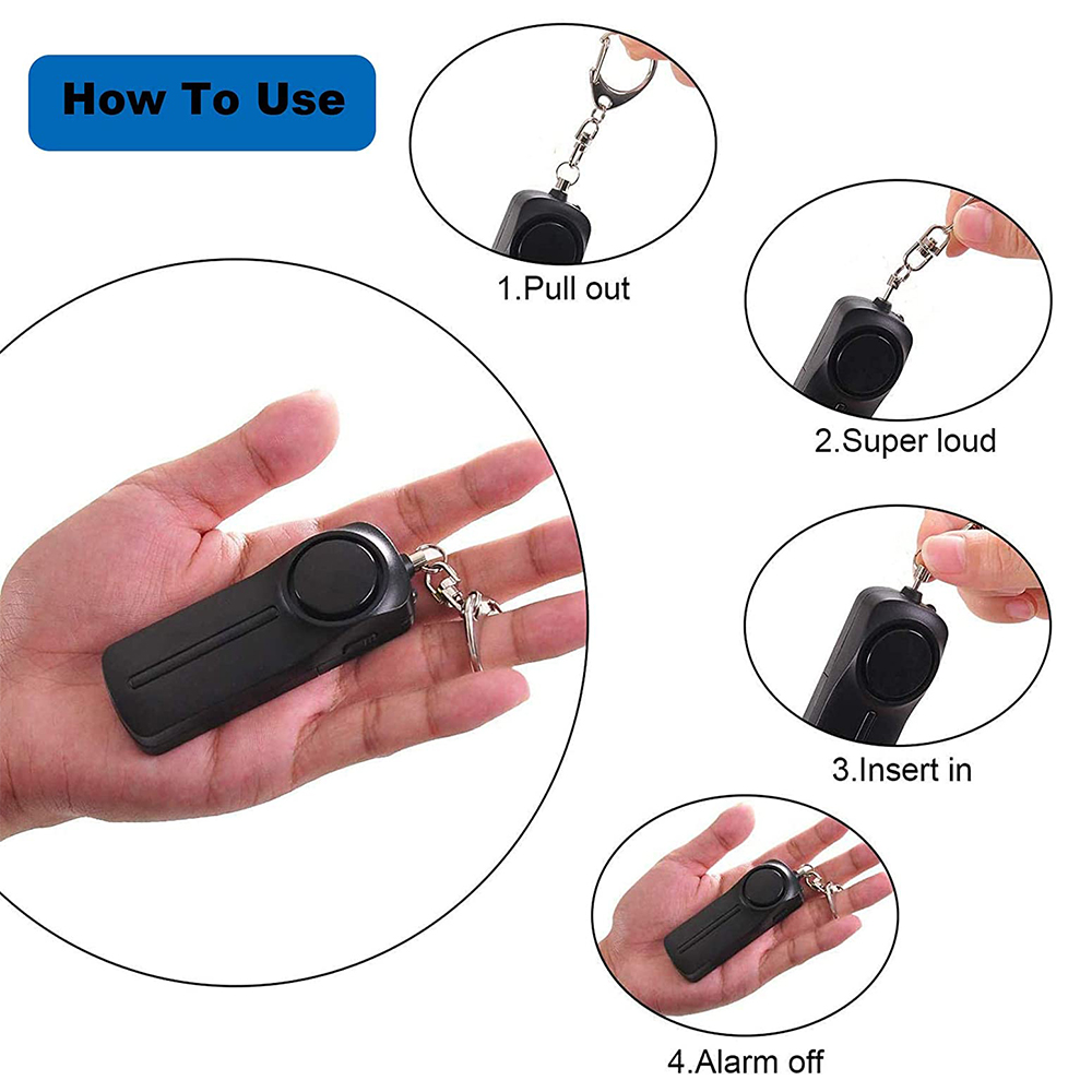 Hand, die einen schwarzen Alarm hält, mit Anweisungen zur Verwendung.