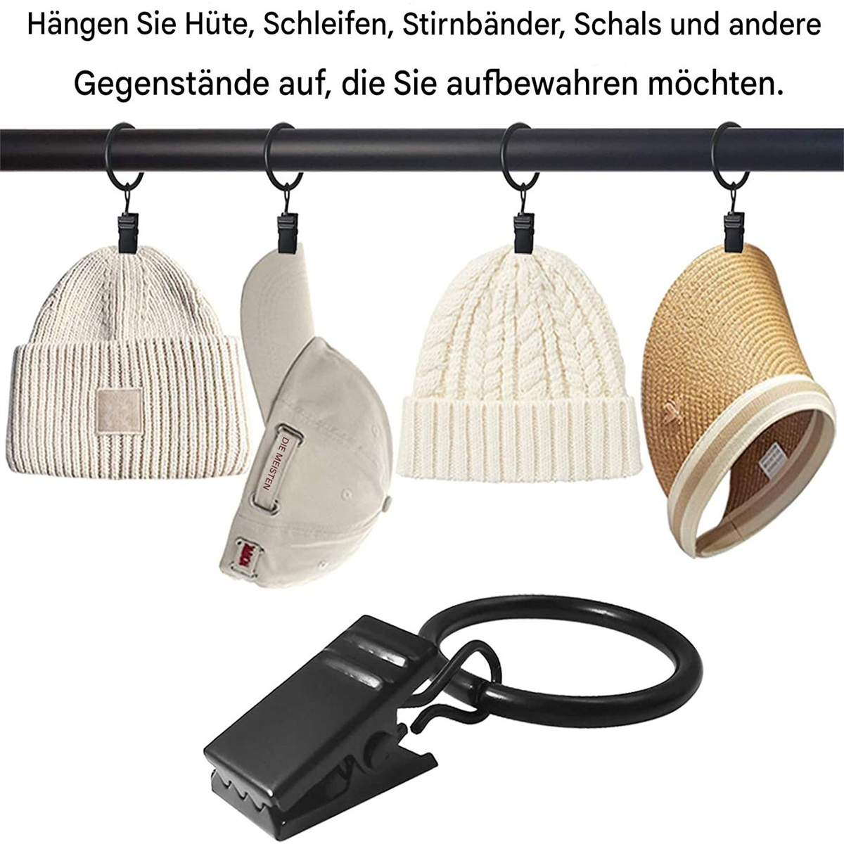 Vier Hüte hängen an einer schwarzen Stange mit Clips. Die Hüte sind in verschiedenen Farben und Stilen.