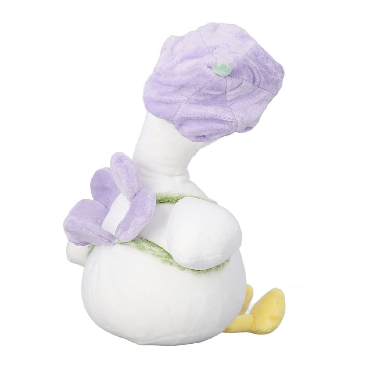 Ein weißes gänseförmiges Stofftier mit lila Kopf und Blume auf der Brust, mit grünen Akzenten.