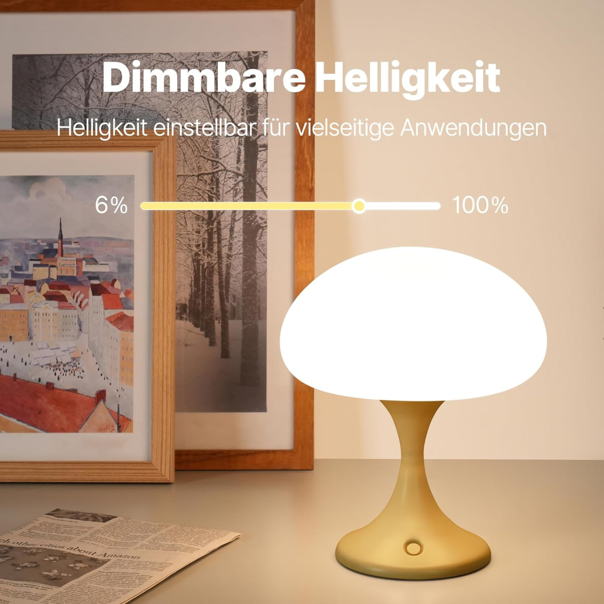 Pilzförmige Lampe auf einem Schreibtisch mit Bildern im Hintergrund. Helligkeitsleiste zeigt 6% bis 100%.