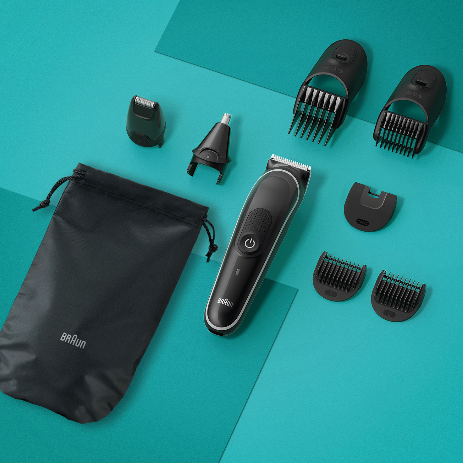 Ein schwarzer Braun Haarschneider mit verschiedenen Aufsätzen und einer schwarzen Tasche.