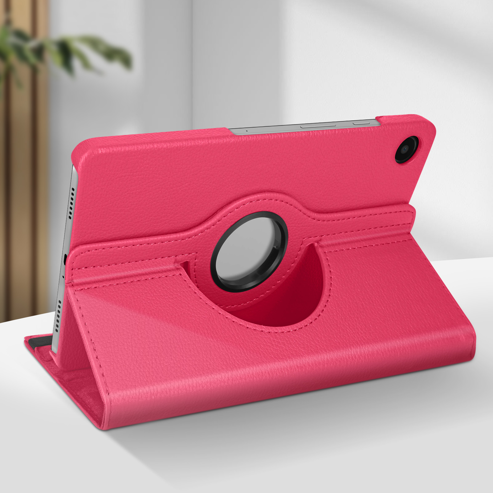 Custodia rosa per tablet con anello rotante, il tablet è in mostra.