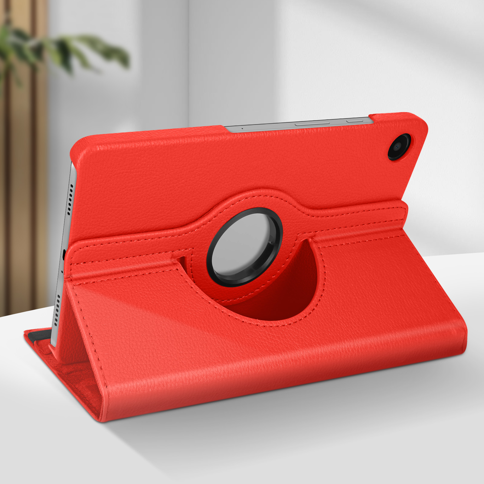 Custodia rossa per tablet con supporto girevole. La custodia è in similpelle, il tablet è posizionato.