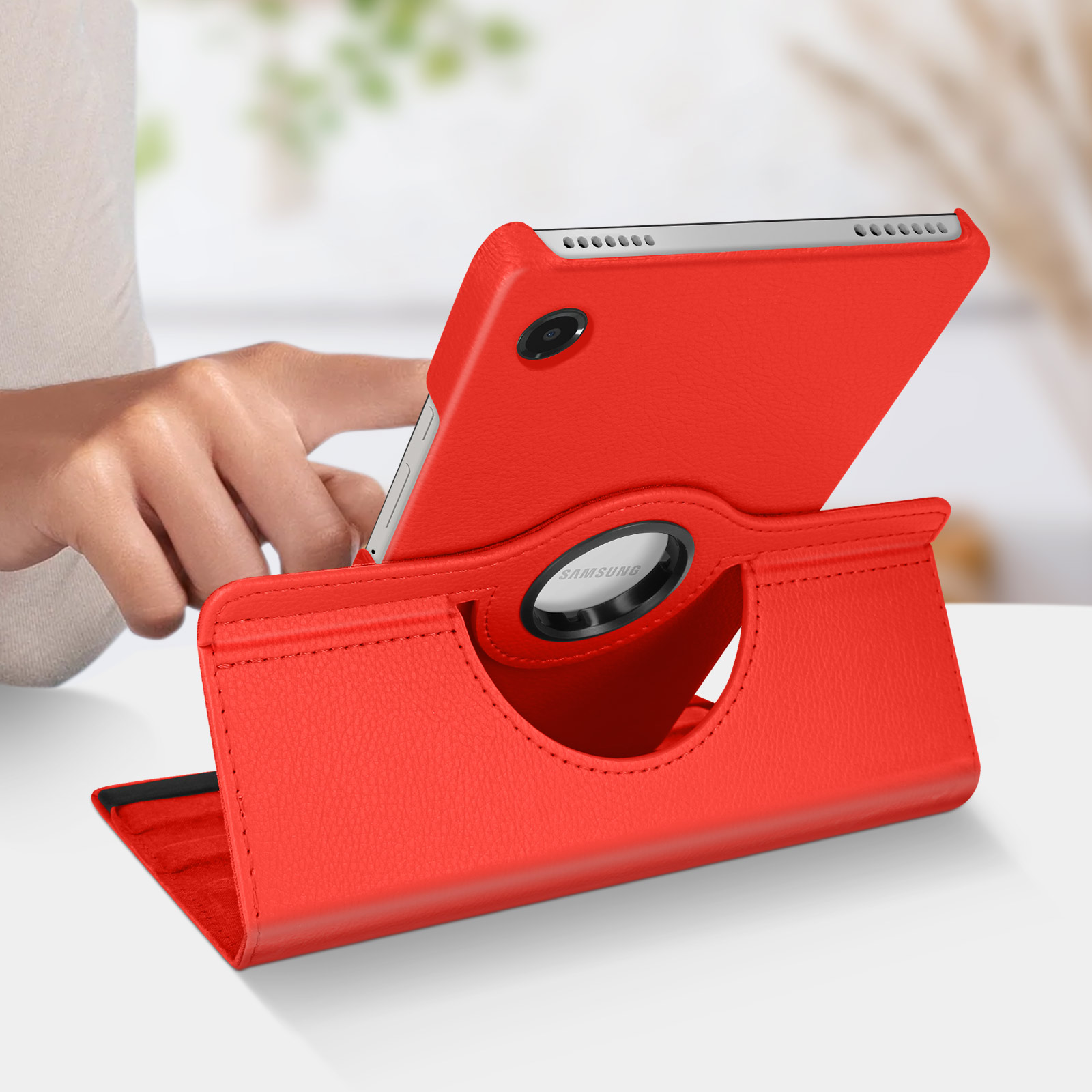 Custodia rossa per tablet in posizione supporto. Il tablet mostra il logo Samsung. La custodia è similpelle.