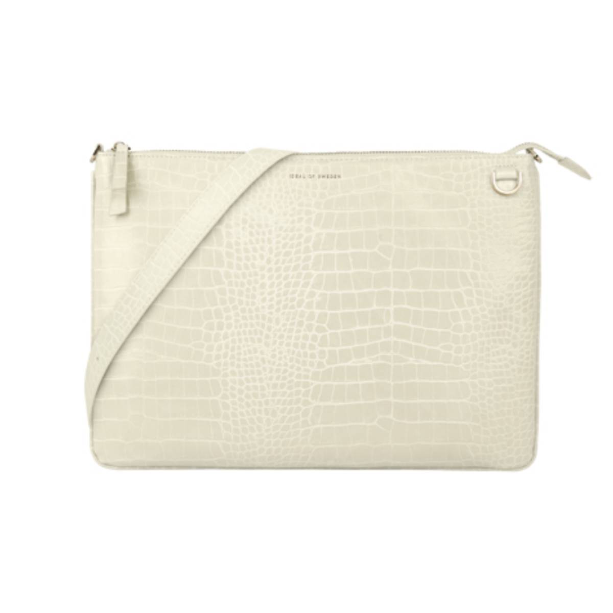 Borsa strutturata color crema con tracolla. La borsa ha una chiusura con cerniera.