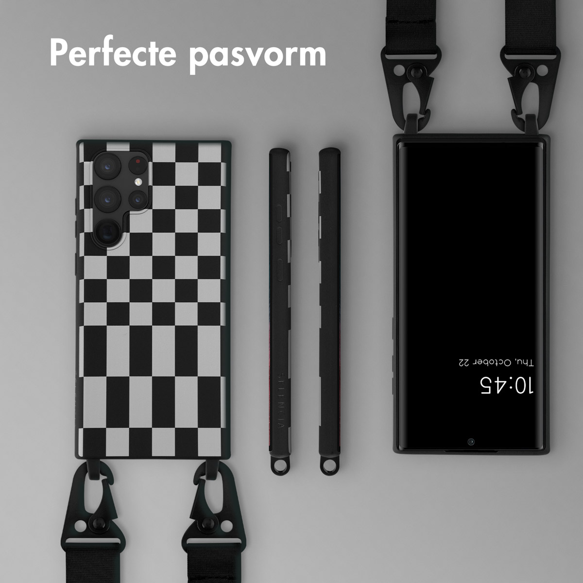Un telefono con custodia a scacchi e accessori, su una superficie grigio chiaro.