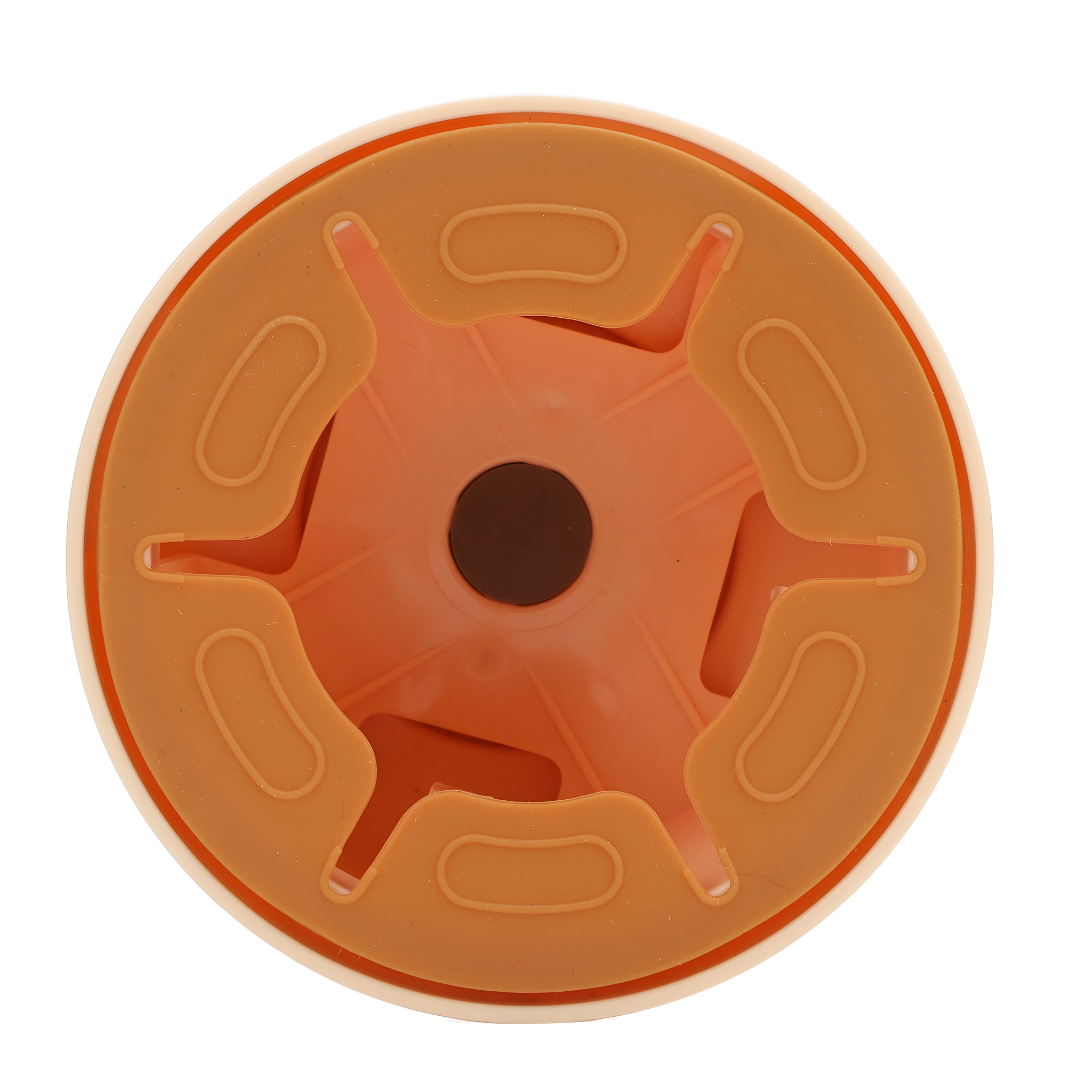 Draufsicht auf ein orangefarbenes und beigefarbenes Kunststoffgerät mit zentraler, sechszackiger Sternform.