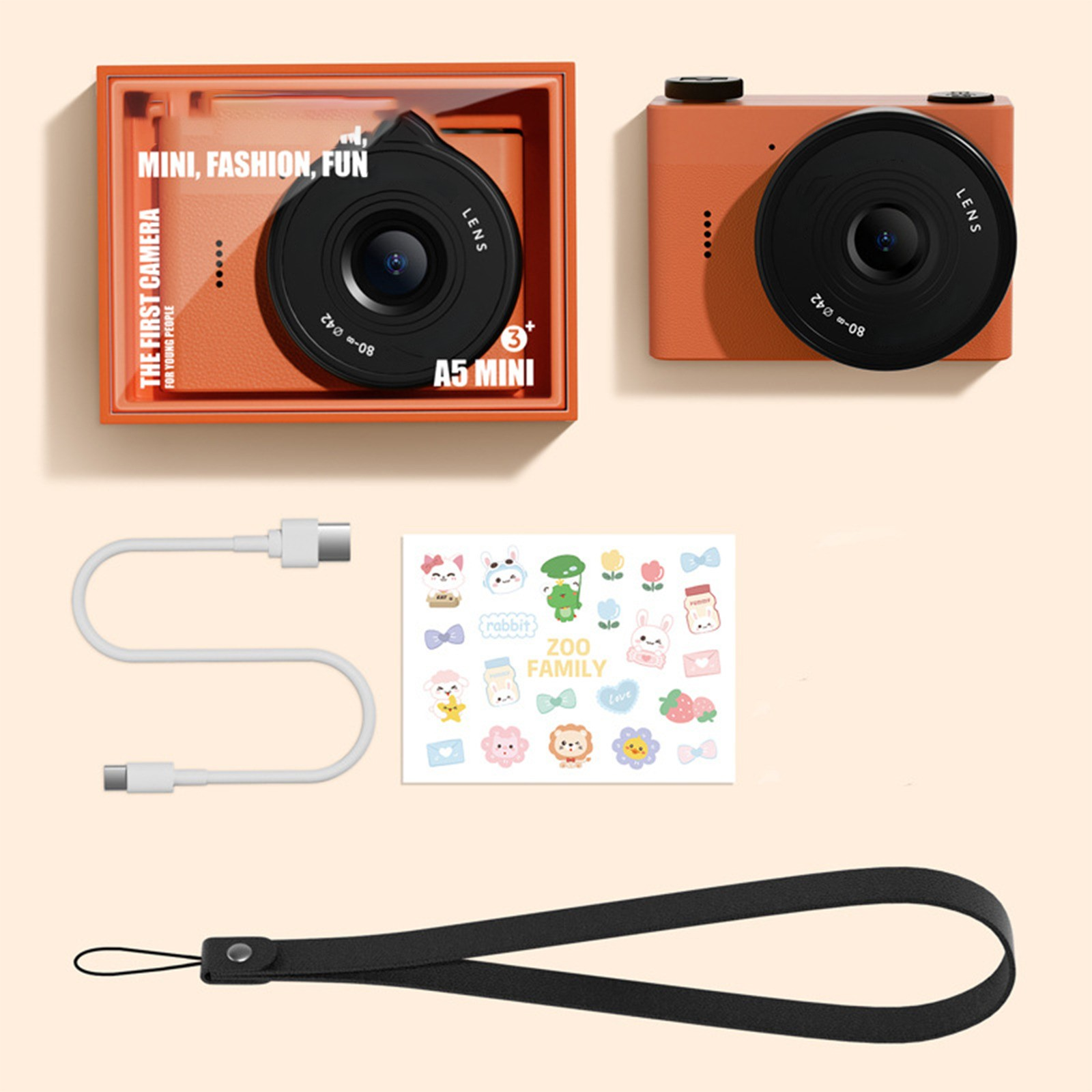 Orangefarbene Kamera in einer Box mit Aufklebern, Riemen und Kabel.