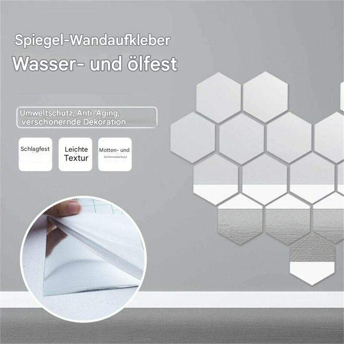 Sechseckige, spiegelartige Wandfliesen mit einer Hand, die eine Schutzfolie abzieht. Die Fliesen sind an einer grauen Wand.