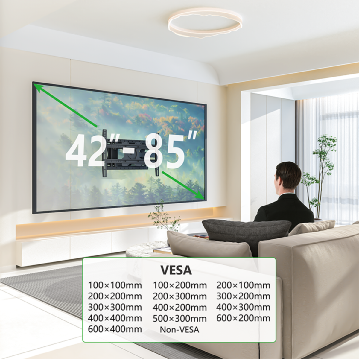 Een man kijkt tv die aan de muur is gemonteerd, met VESA-specificaties.