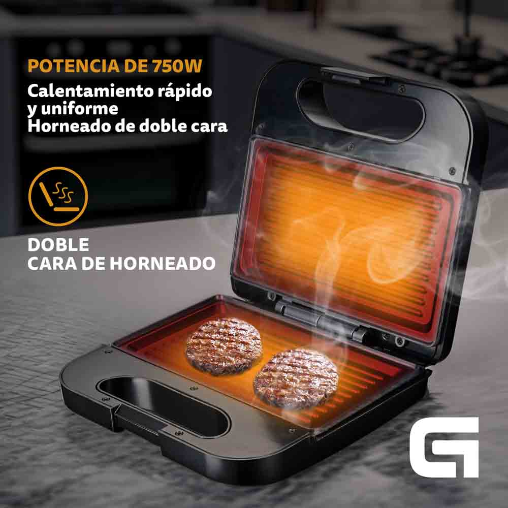 Sandwichera de doble cara, abierta, con dos hamburguesas cocinadas. Texto arriba. Negro y plata.