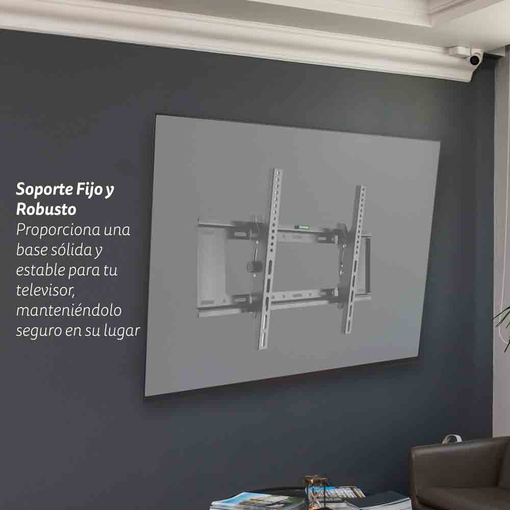 Soporte de TV gris fijado a una pared azul oscuro. Texto español describe características.