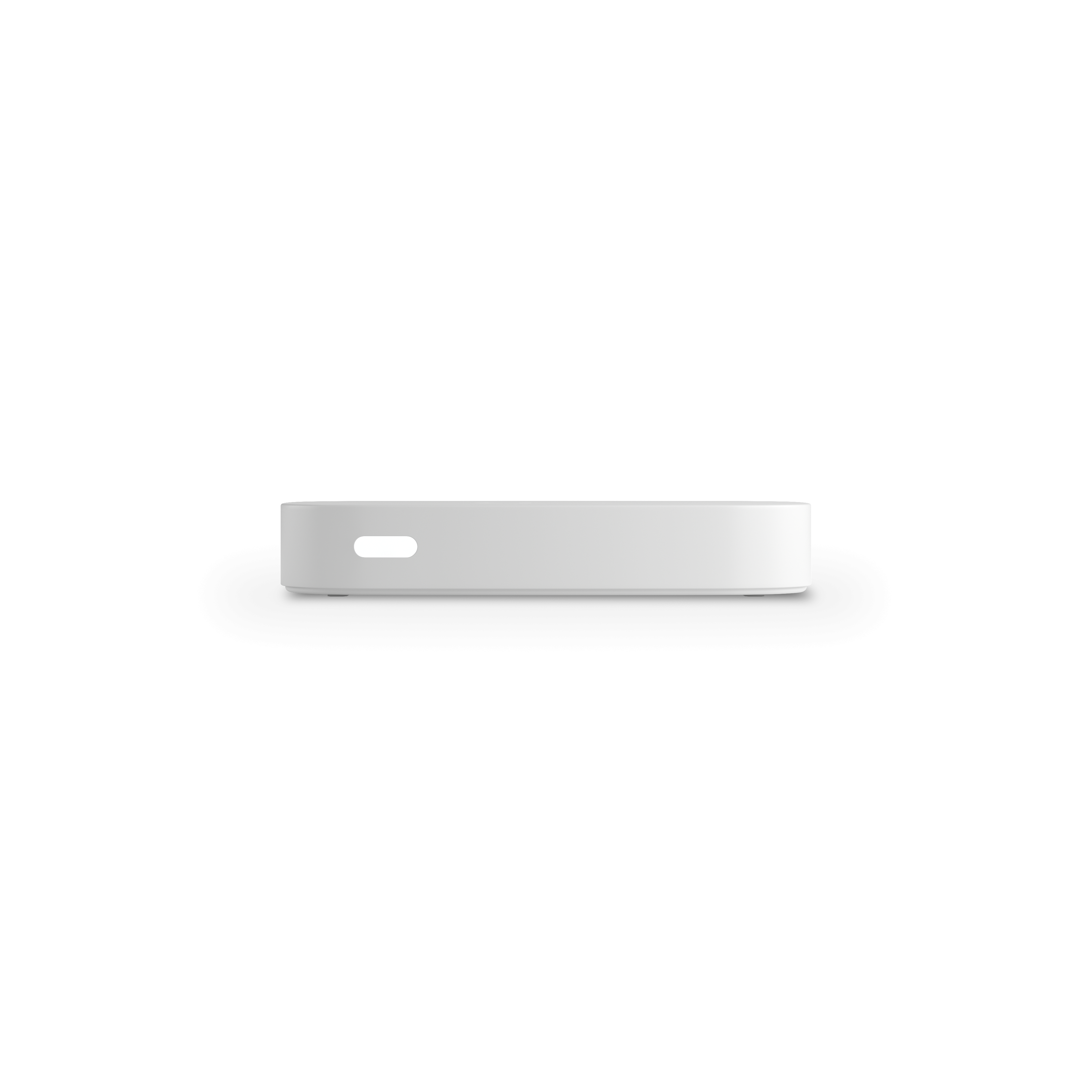Un pequeño dispositivo blanco, posiblemente un reproductor multimedia o similar, visto de lado.