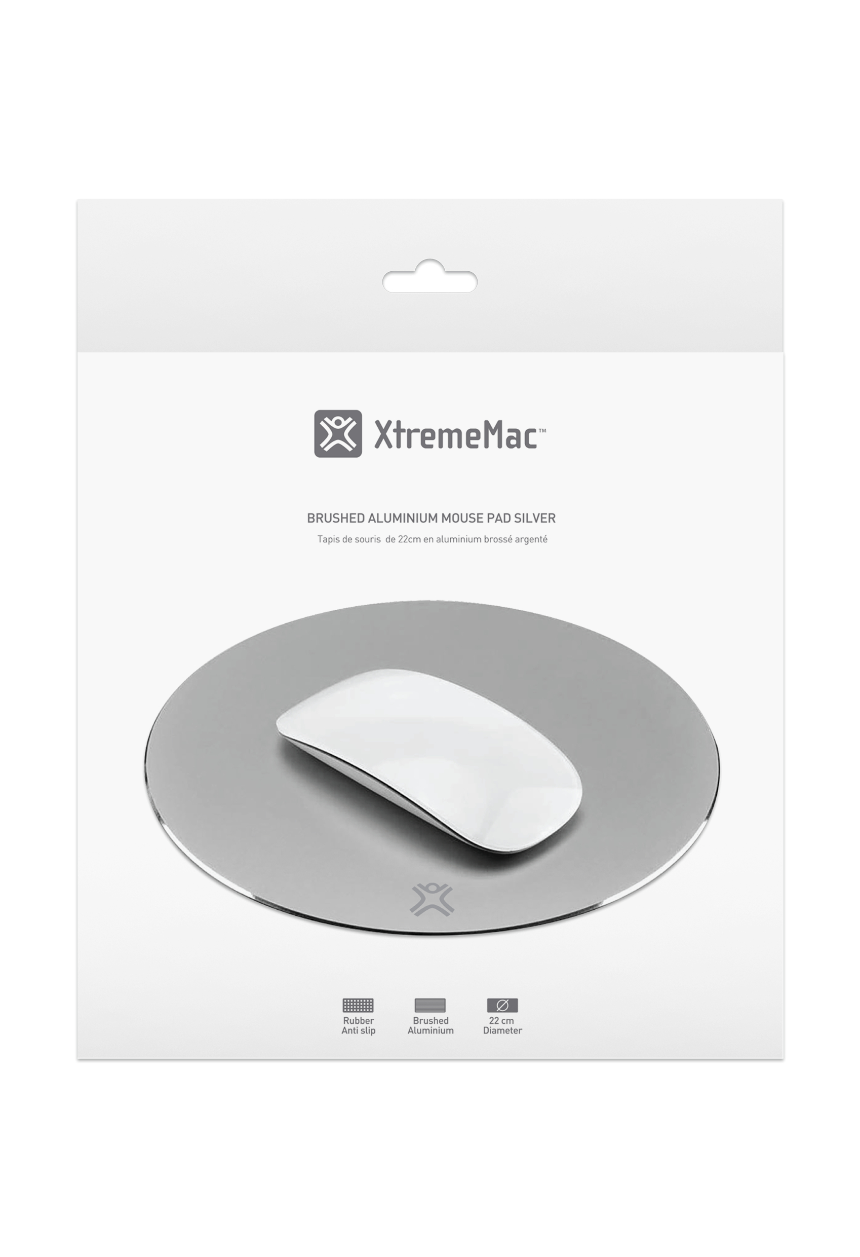 Weiße Maus auf einem silbernen Mauspad in einer weißen Verpackung. XtremeMac und Text sind sichtbar.