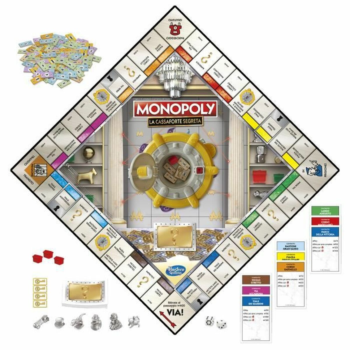 Juego de mesa Monopoly con una bóveda central y varias piezas dispersas.