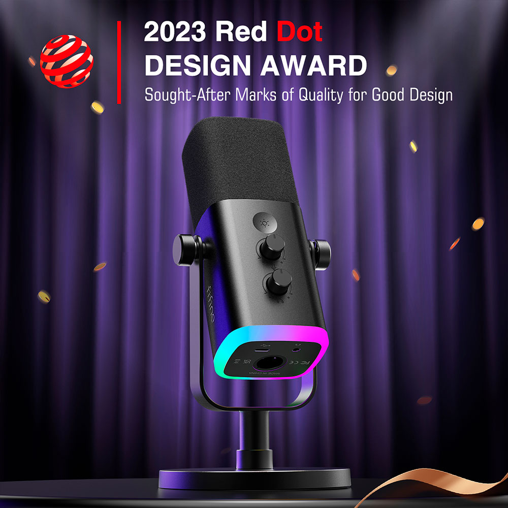 Micro noir avec une étiquette Red Dot Design Award, sur un support. Fond de rideau violet.