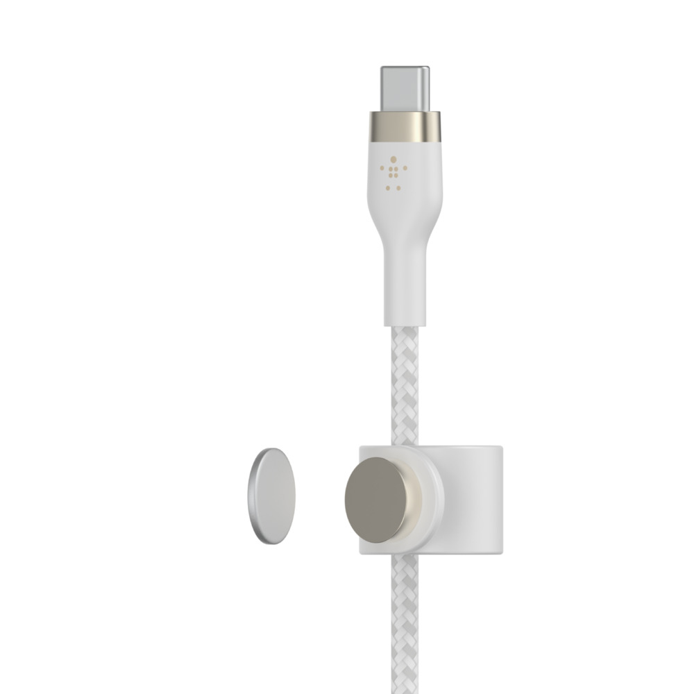 Câble de chargement blanc avec connecteur blanc et doré et disque magnétique.