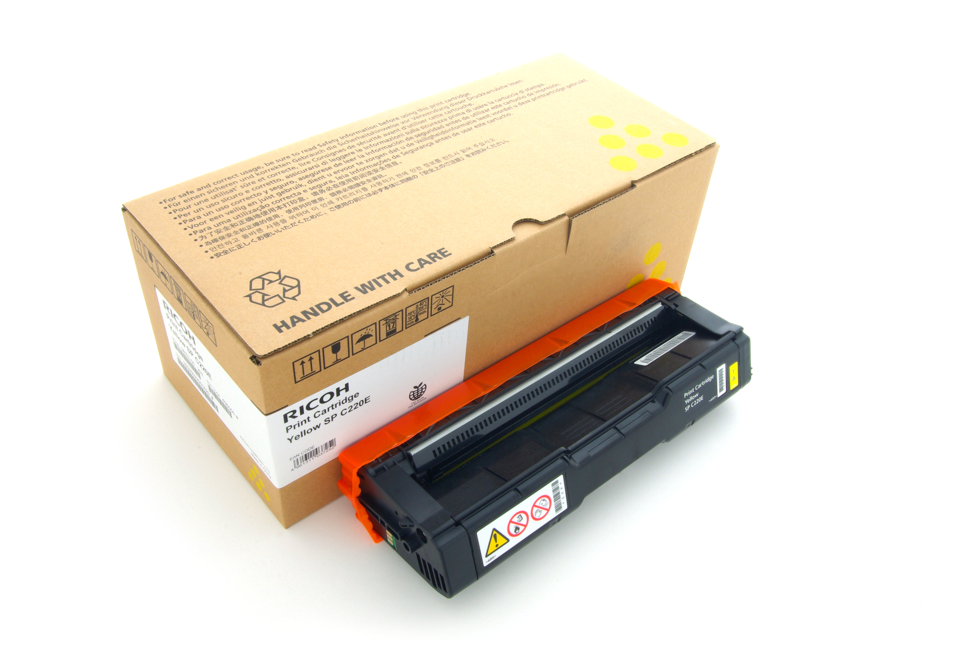 Una cartuccia toner e scatola gialle su una superficie bianca. La scatola ha testo e la cartuccia è nera e gialla.