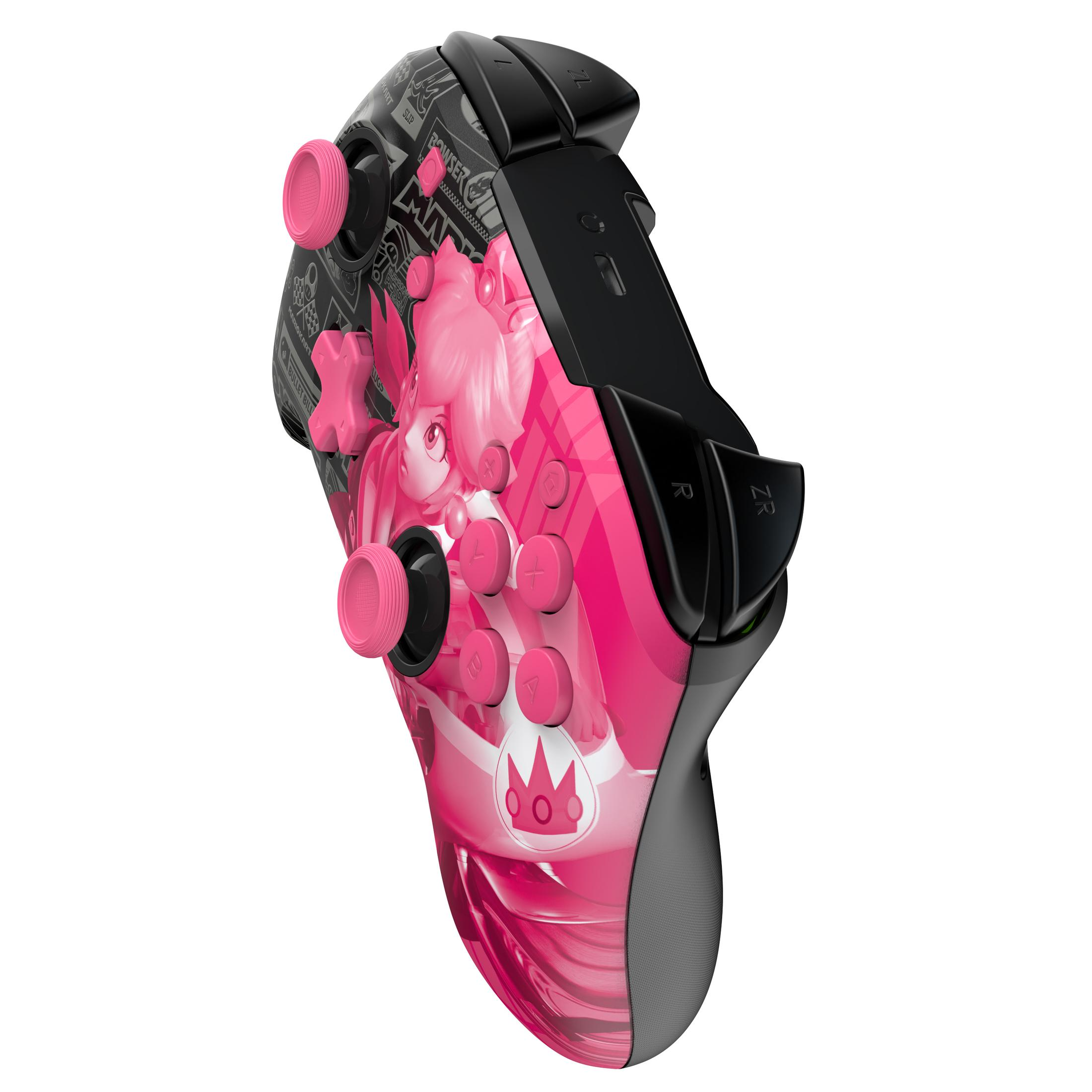 Różowy i czarny kontroler Nintendo Switch z grafiką Princess Peach. Widoczne różowe gałki i przyciski.
