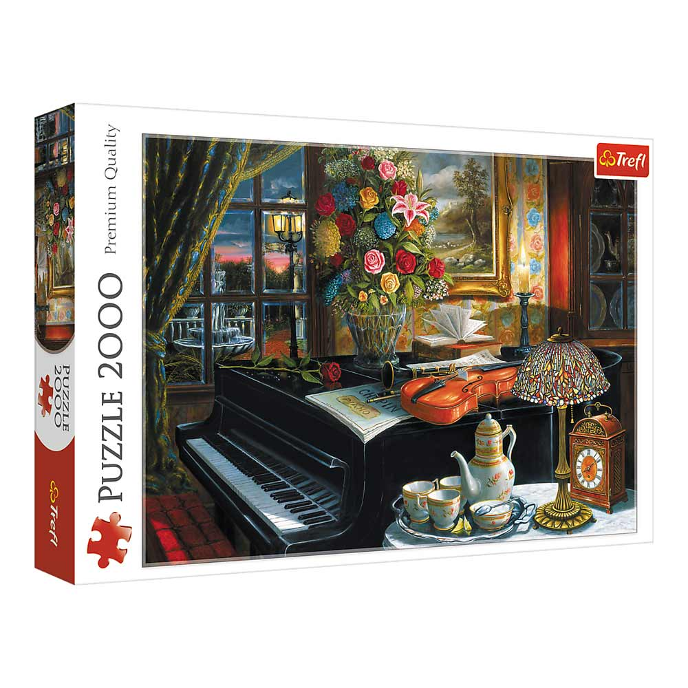 Pudełko z puzzlami z fortepianem, kwiatami i instrumentami muzycznymi. Jest lampa i zegar.