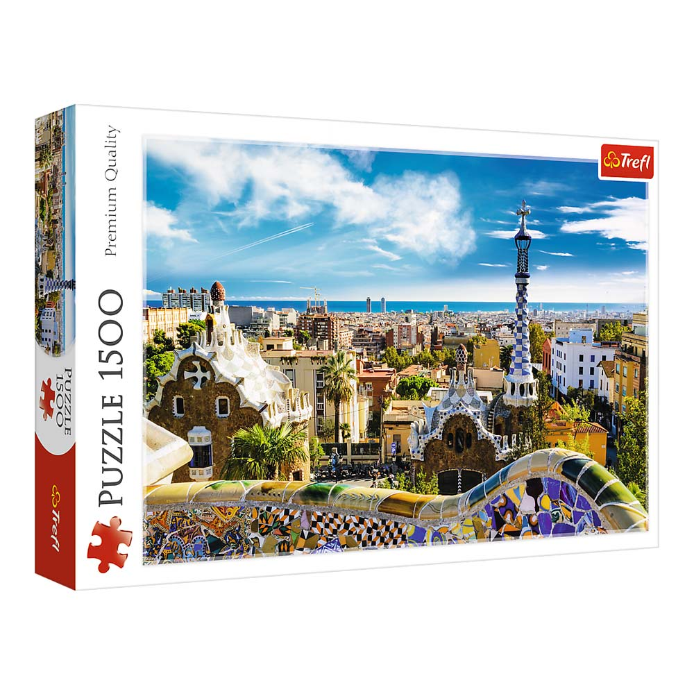 Pudełko z puzzlami ze zdjęciem sceny miejskiej z budynkami, mostem i błękitnym niebem.