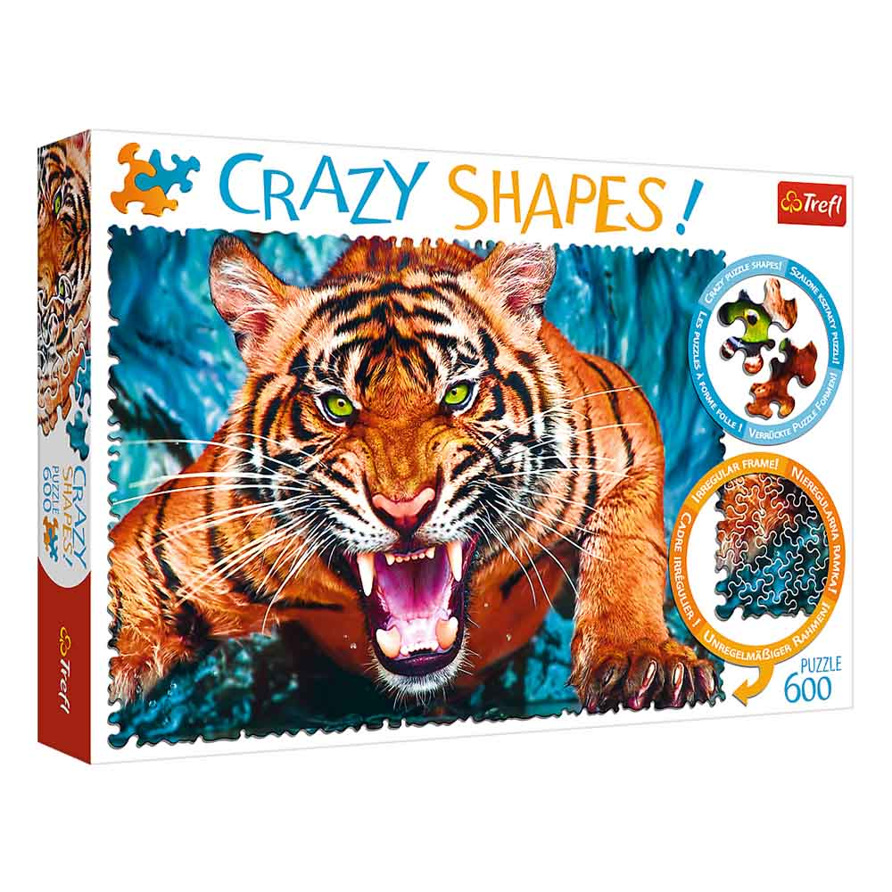 Pudełko z puzzlami z tygrysem. Tygrys jest pomarańczowy z czarnymi pasami i zielonymi oczami. Tygrys warczy.
