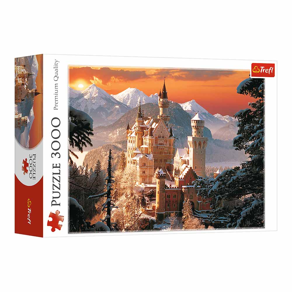 Puzzle przedstawia zamek w zaśnieżonym górskim krajobrazie, z zachodem słońca w tle.