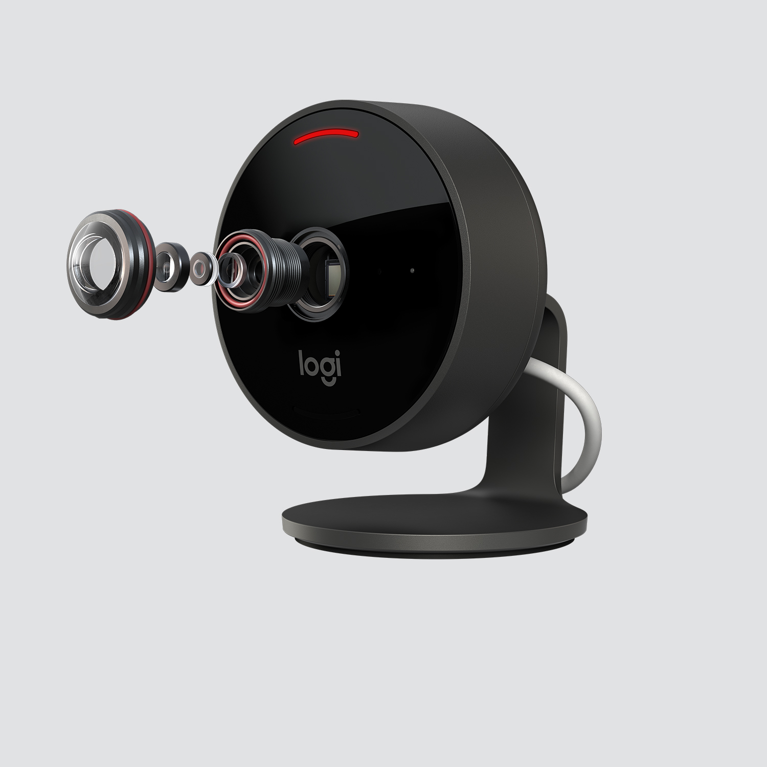 Telecamera Logi nera con luce rossa, vista smontata, su sfondo grigio.