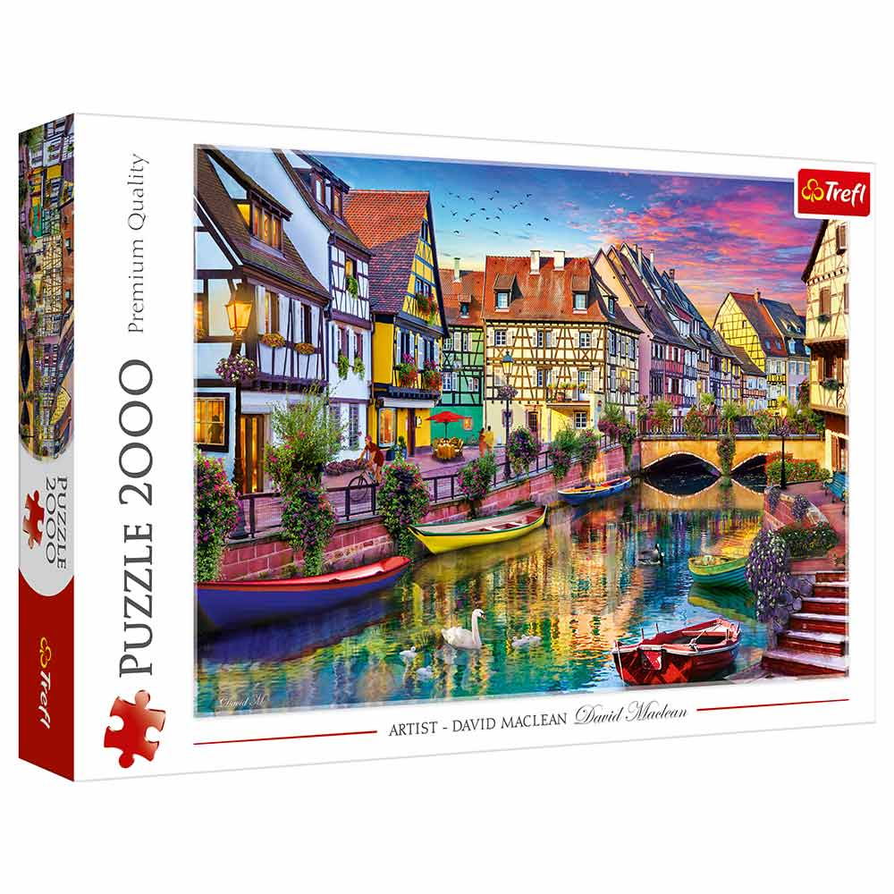 Puzzle europejskiego miasteczka z kolorowymi budynkami, łodziami i kanałami.