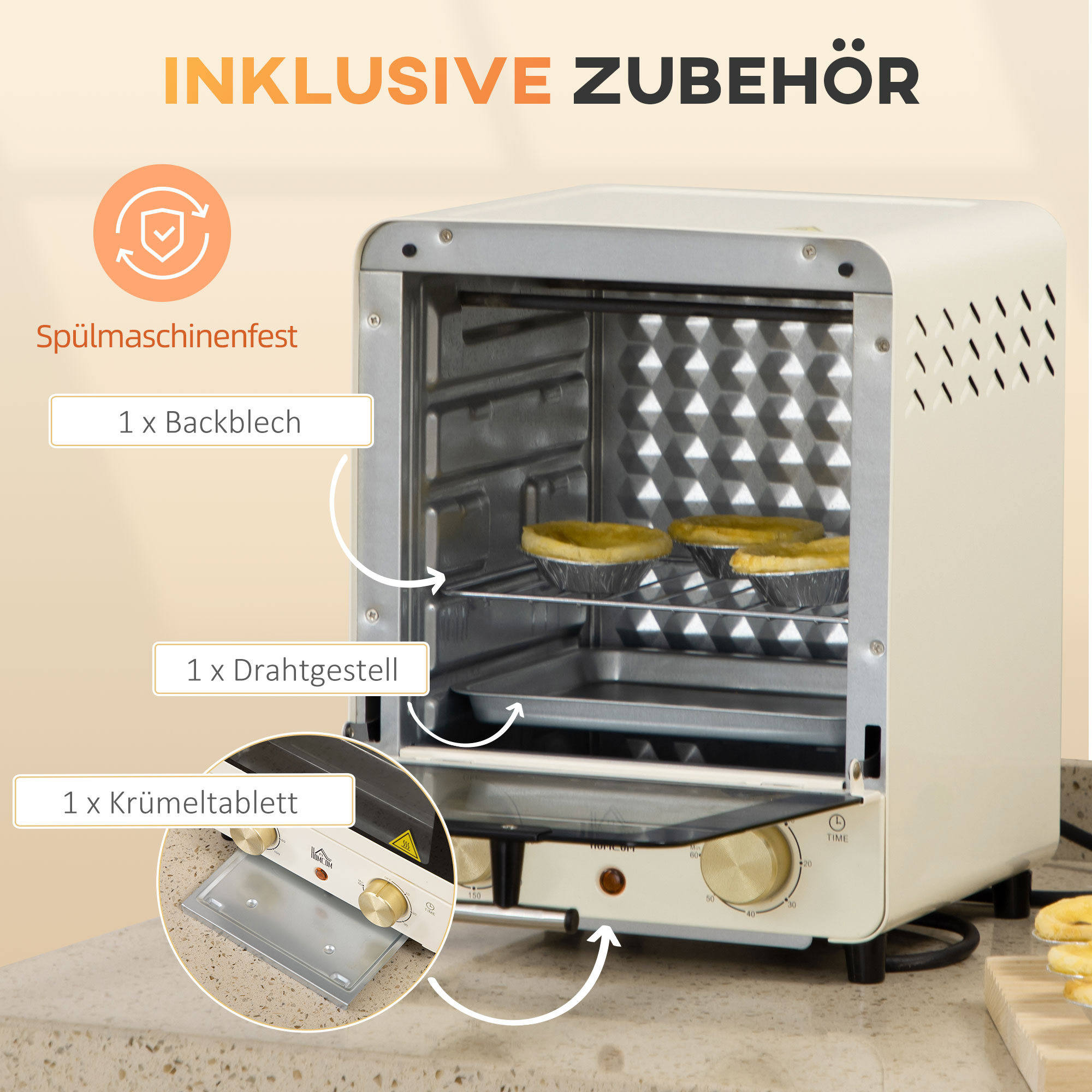 Cremefarbener Mini-Ofen mit Zubehör. Er hat einen Drehknopf und steht auf einer Arbeitsplatte.