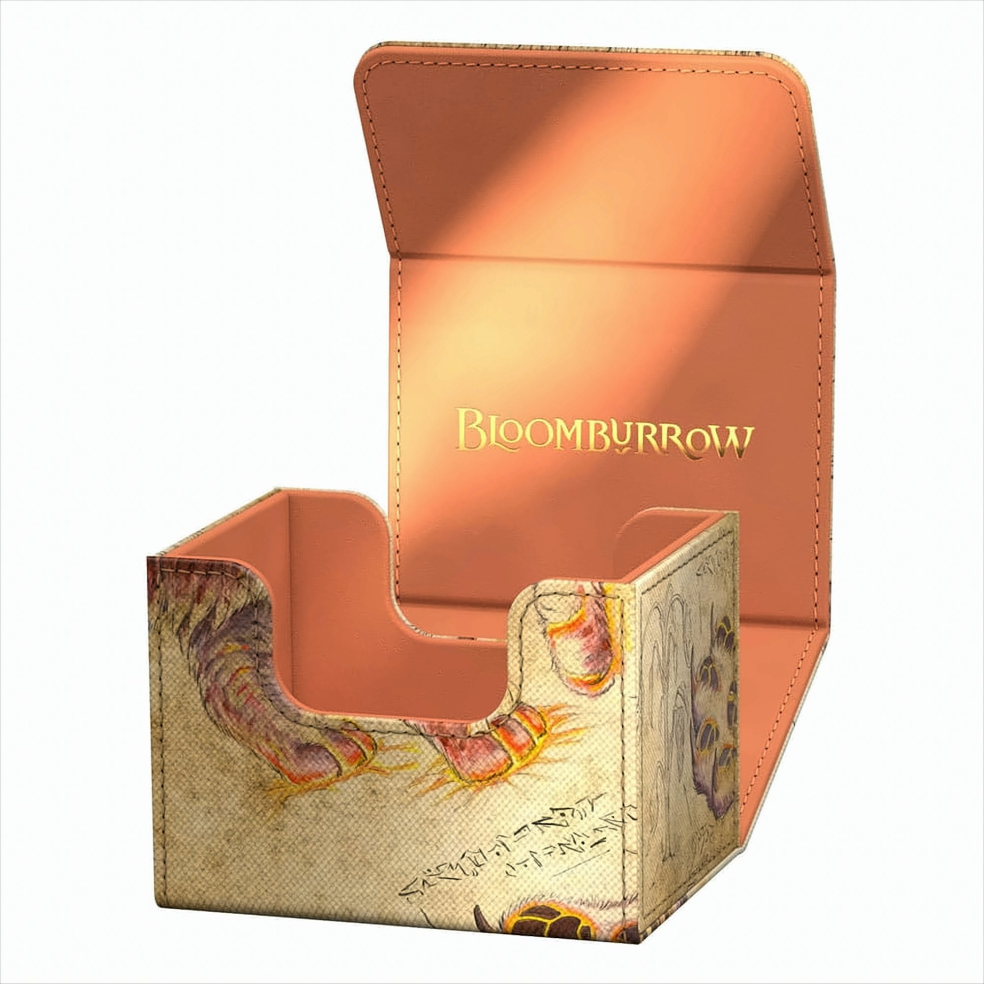Eine offene Kartenspielbox, innen hellorange, mit dem Namen 'BLOOMBURROW' in Gold und einem Design außen.
